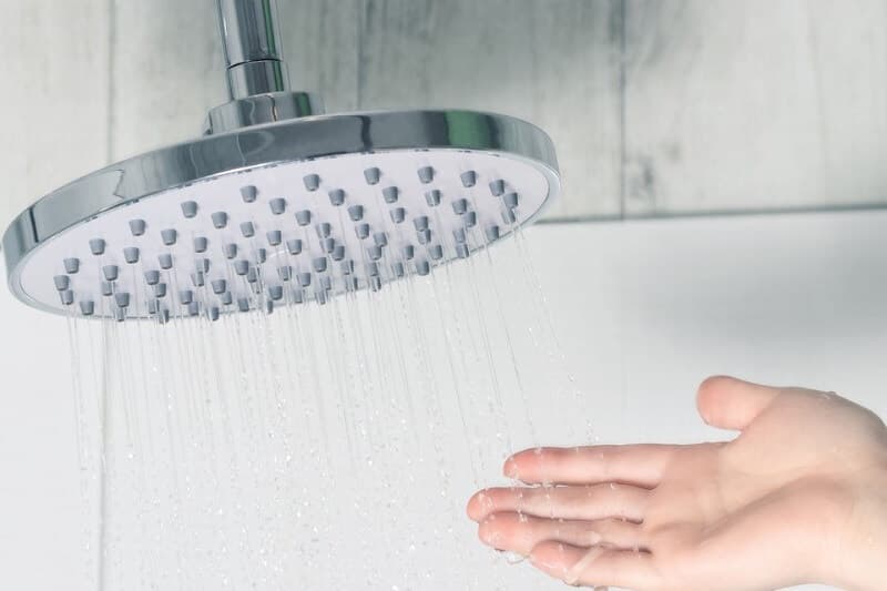 Shower running while the water warms