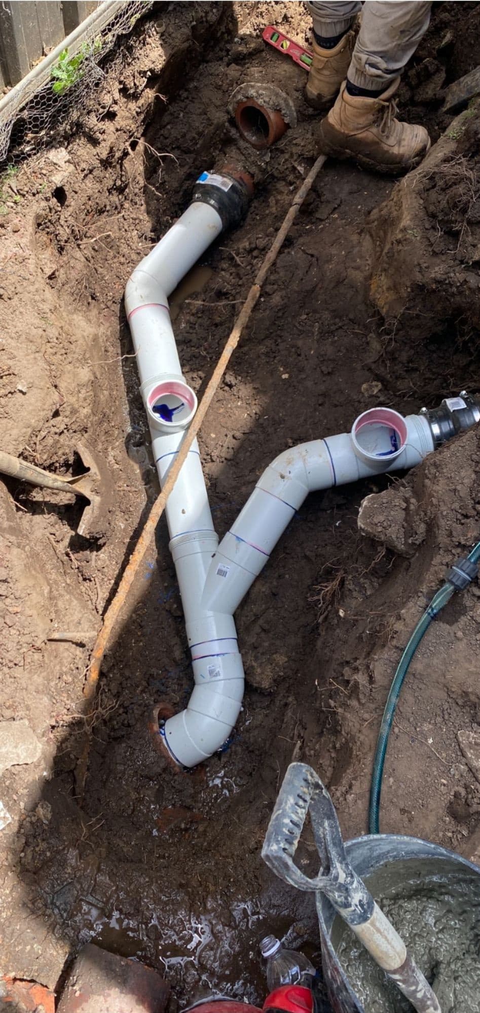 White pipe junctions connected to existing underground drains