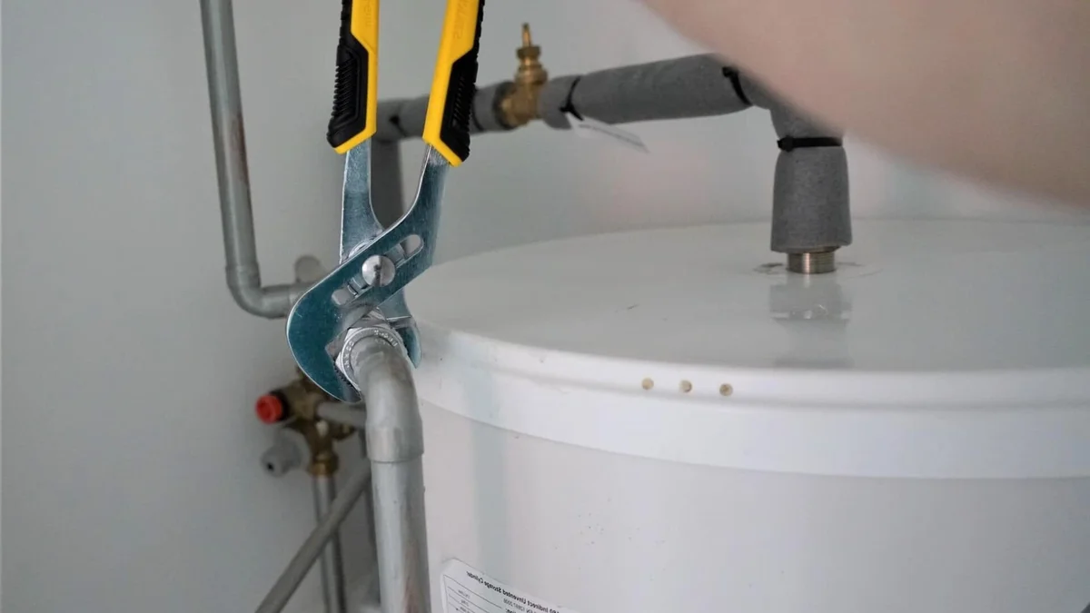 Plumber repairing a hot water system in Annangrove