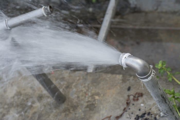 Emergency plumber responding to a burst pipe in an apartment building in Milperra