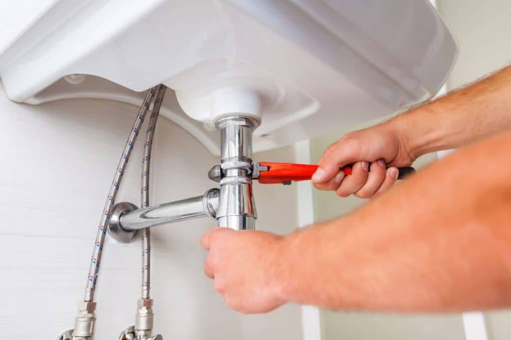 Strata plumber working in an apartment building in Milperra